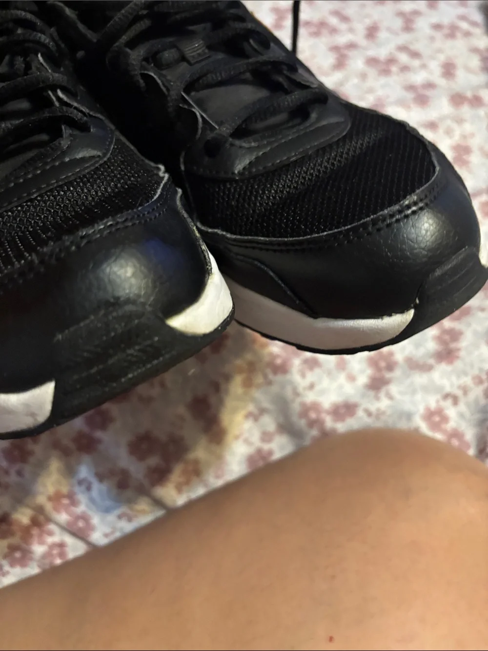 Nike Women's Black Sneakers with Subtle Gold Accent